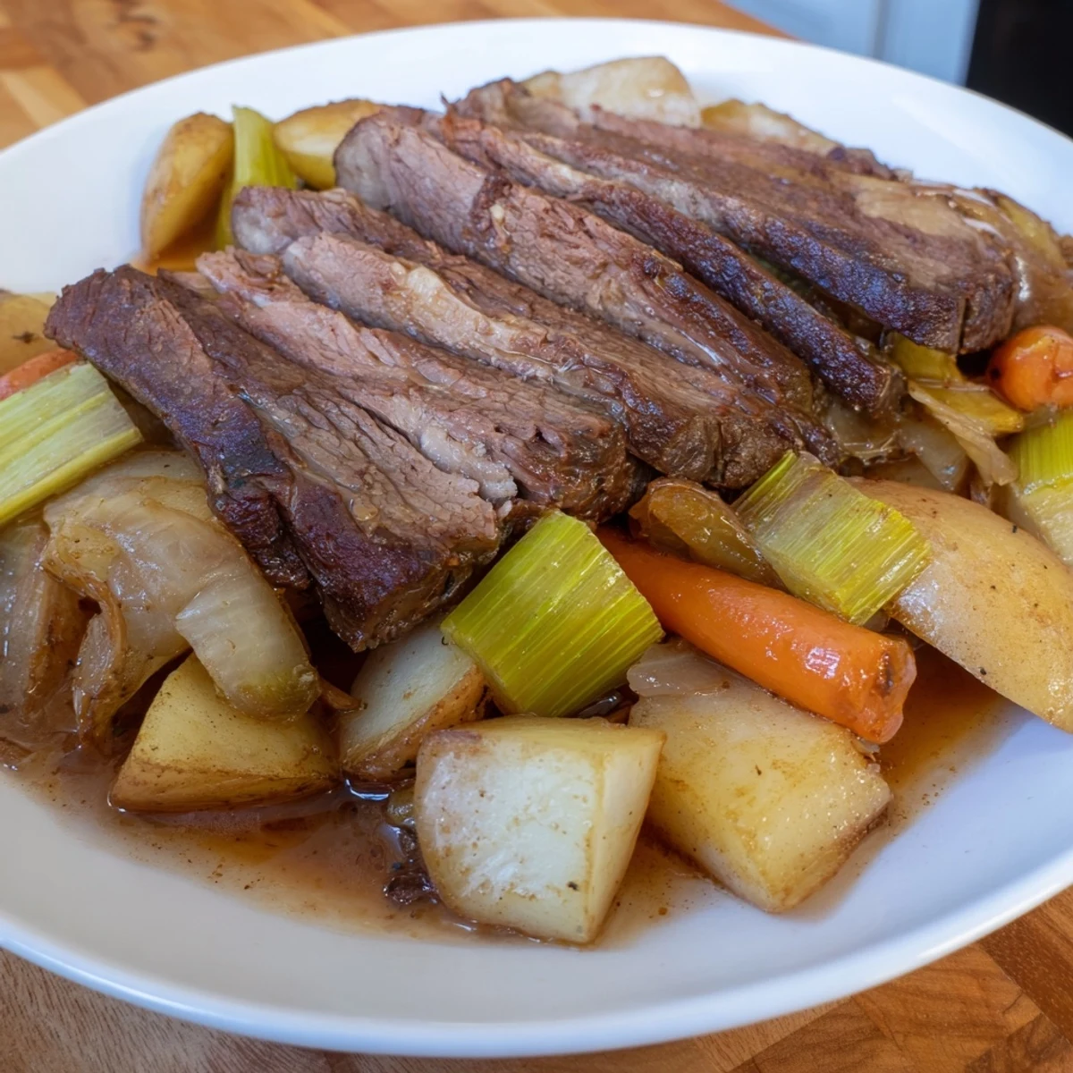 Succulent Sunday Pot Roast with tender, fall-apart beef and roasted vegetables, beautifully plated.