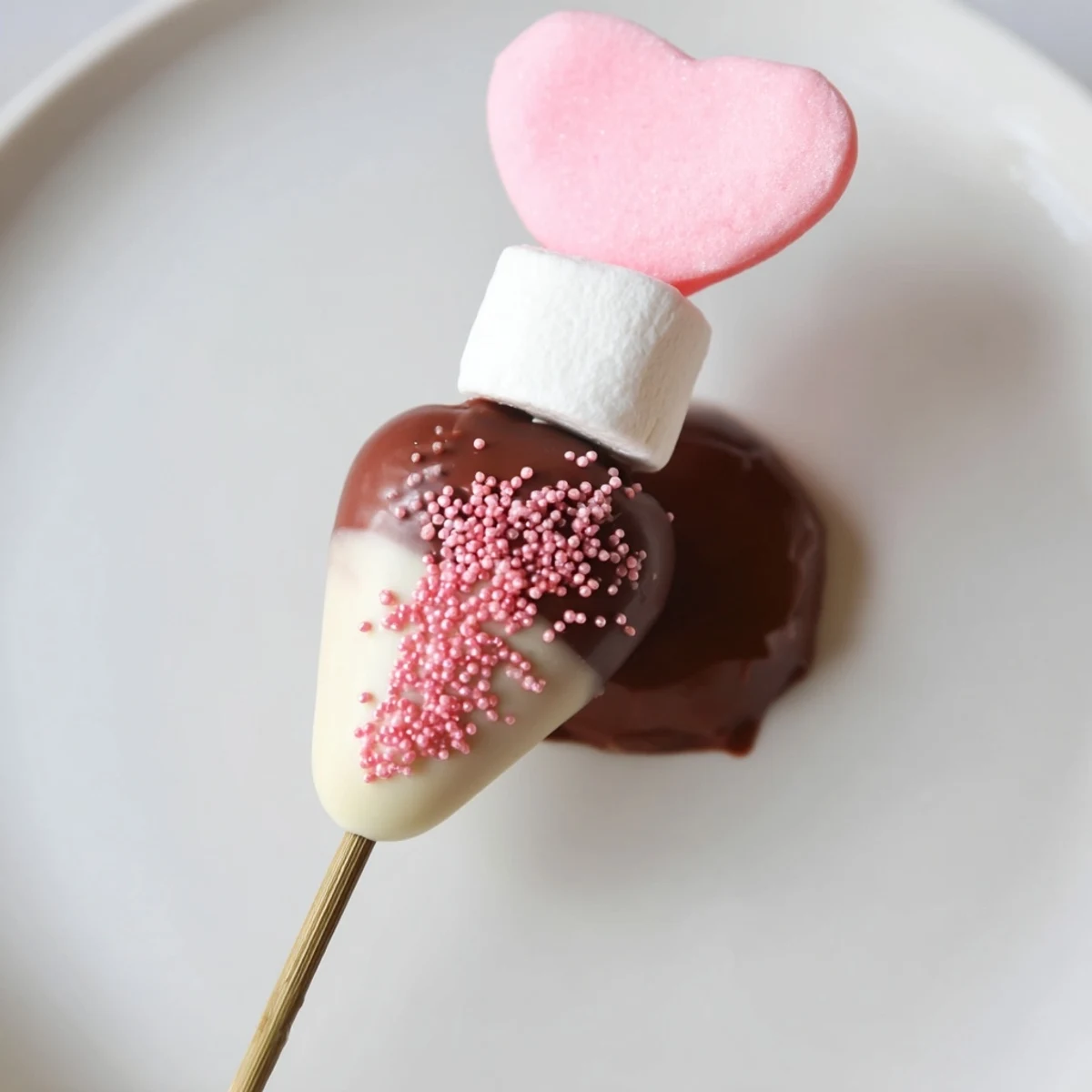 A beautiful Cupid's Arrow Candy Tray, showcasing heart candies and chocolate-covered strawberries, ready to serve.