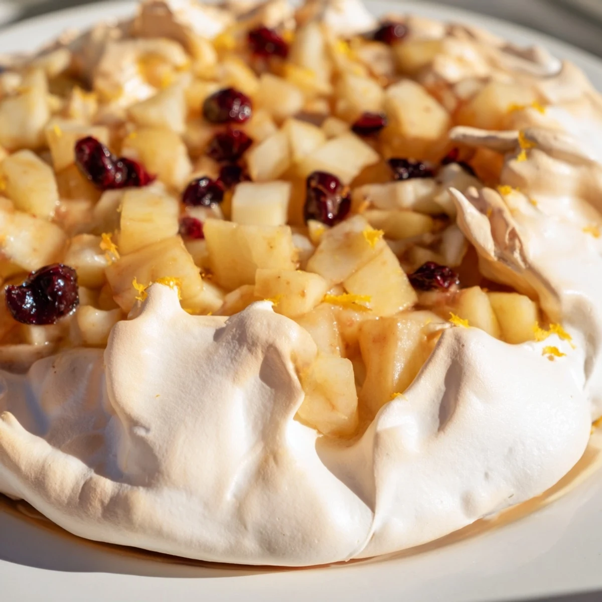 Sweet meringue crowns the baked Cranberry and Pear Snowscape, a snowy-white wintertime treat for sharing.