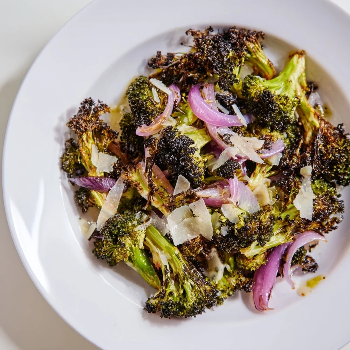 Image of a delicious Charred Broccoli Salad, perfectly roasted with Parmesan cheese and a lemon dressing.