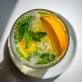 Refreshing probiotic soda mocktail featuring citrus juices and sparkling effervescence.  