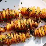 Golden spiral potatoes, seasoned and air-fried, a tasty side dish option.  