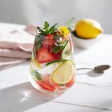 Deliciously hydrating Water-Based Mocktails, featuring mint, strawberries, and lemon slices.  