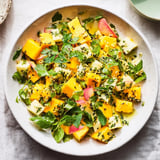 Freshly tossed Sunlit Glade salad with diced mango and apple, ready for serving guests.