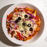 A close-up of quick one-pot pizza pasta, showing pasta coated in rich marinara with cheese.