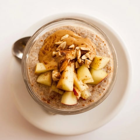 Apple-Chia Pudding with Peanut Butter: creamy layers of pudding, apple, and peanut butter drizzled with maple syrup.