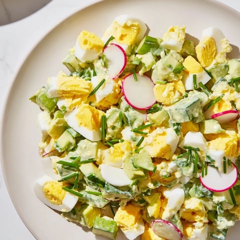A vibrant, creamy Green Goddess Chopped Egg Salad filled with fresh, crunchy vegetables.