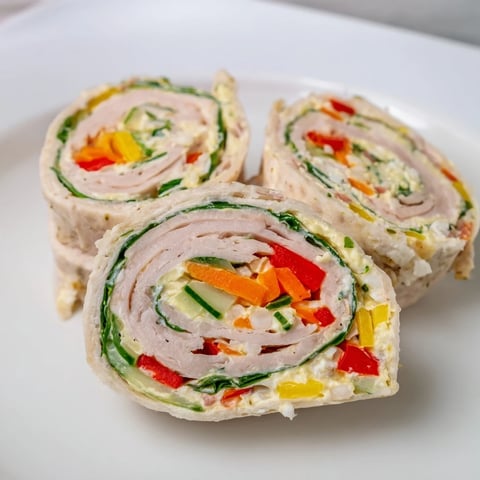 Beautiful Christmas tree of Smoked Turkey Pinwheels, savory appetizer ready for a festive holiday.