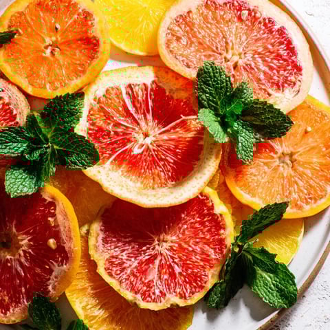 A colorful Fruit Board: Citrus Slice Garland Platter, arranged beautifully for a refreshing brunch treat.