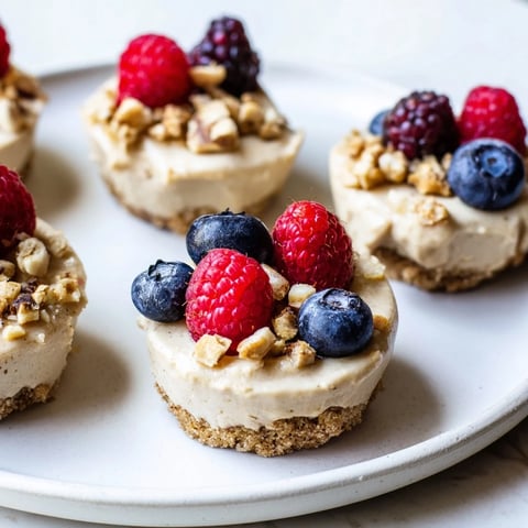 A chilled Protein Cheesecake Cup, topped with fresh berries, offering a creamy, healthy dessert idea.