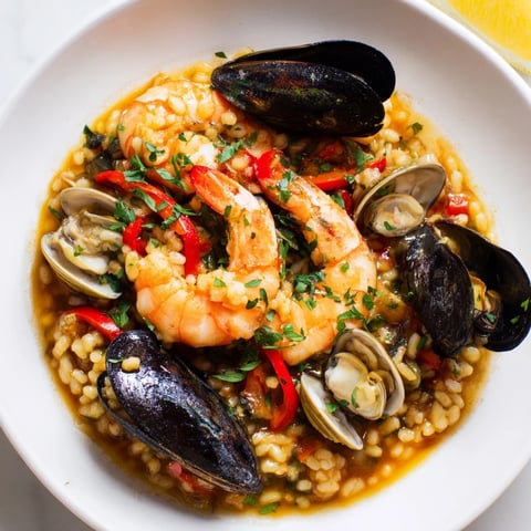 Golden saffron-infused rice and plump seafood star in this tempting Spanish Seafood Paella.