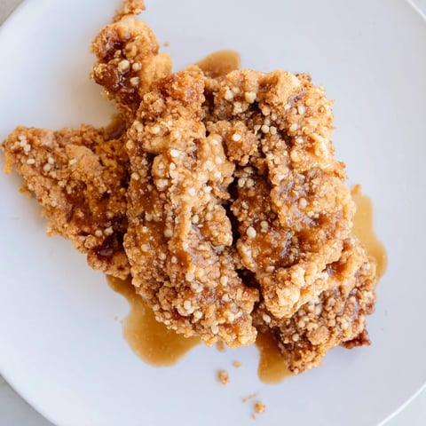 Golden-brown hot honey butter chicken, glistening and perfectly coated, ready to serve with sides.