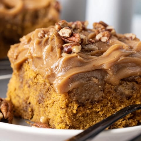 Butterscotch Pecan Pumpkin Sheet Cake adorned with crunchy pecans and vibrant autumn flavors.  