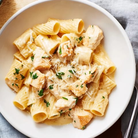 A comforting bowl of Creamy Garlic Parmesan Chicken Rigatoni, bursting with flavor and warmth.  