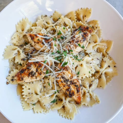 Golden chicken pieces and bowtie pasta coated in a delicious Mozzarella Garlic Butter sauce.