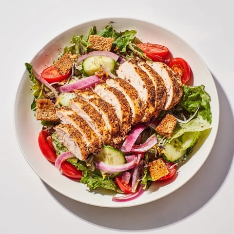 This Quick Crunchy Lemon Parmesan Chicken Salad features a bright, zesty dressing over plentiful ingredients.