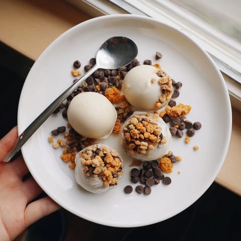 Close-up of a delightful Hot Cocoa Bomb Topping Bar bar, full of colorful toppings like sprinkles and candy.