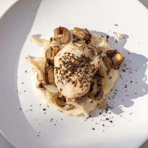 White mushrooms and swirling pepper create dramatic shadows in this Ghostly Gala dish.