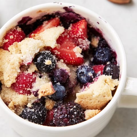 Homemade Mixed Berry Cobbler Mug Cake, a delightful single-serve dessert ready in minutes.