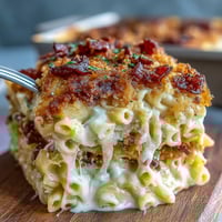 1. Soul Food Baked Mac and Cheese with Crunchy Top, featuring creamy, cheesy pasta beneath a golden, crispy breadcrumb layer.  