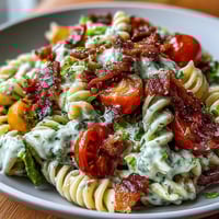 BLT Pasta with Avocado Ranch: creamy avocado ranch dressing coats bacon, tomatoes, and lettuce over tender pasta in a summer salad.